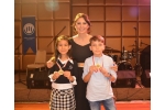 Nisa Üresin and Baki Cem Sirkecioğlu, the winners of the best picture and description award on waste and efficiency, were given their awards by DÖSİAD YKB Ms. Gültekin Gencer.