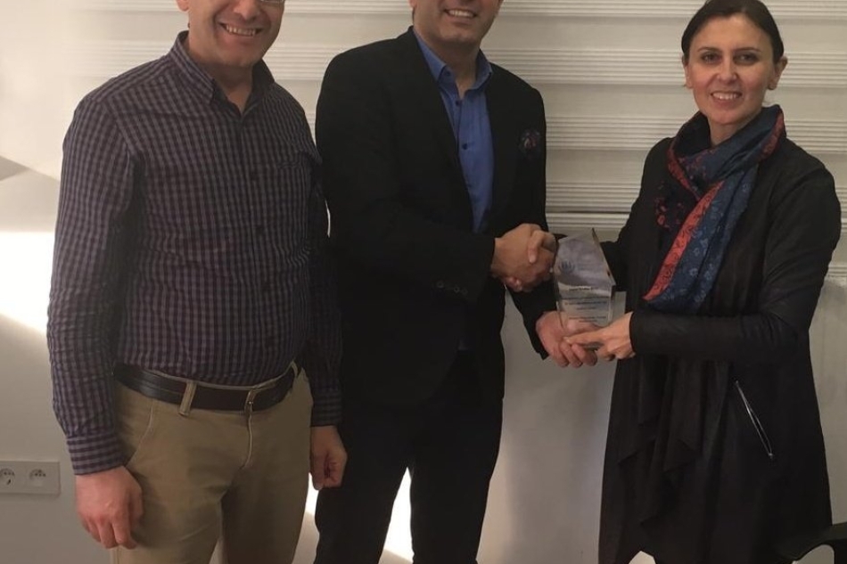 A plaque of appreciation was presented to Berdan Ber, Vice President of Industrial Engineering Association.